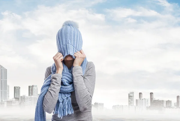 Pretty young woman covering her head — Stock Photo, Image