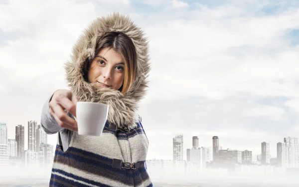 Woman offering cup of coffee — Stock Photo, Image