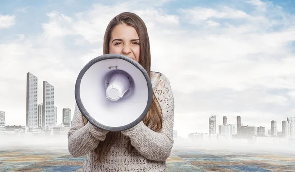 Pretty girl talking on megaphone — Stock Photo, Image