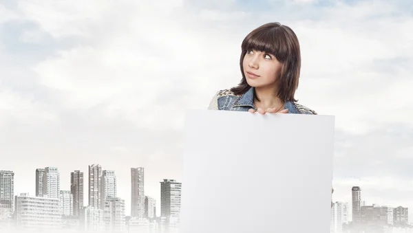 Young woman holding white banner — Stock Photo, Image