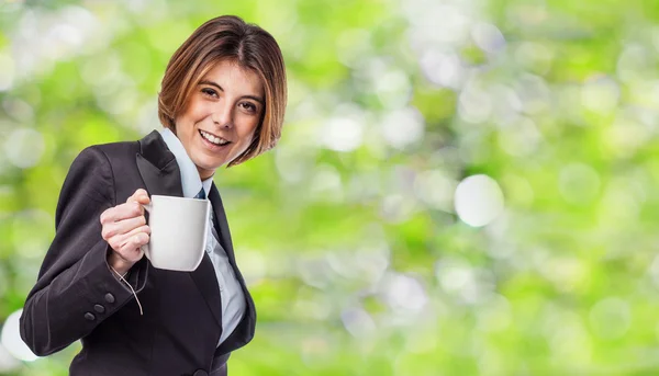 Young woman holding cup of coffee — Stock Photo, Image