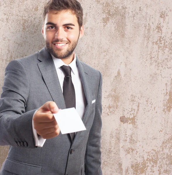 Young businessman giving personal card — Stock Photo, Image