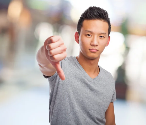 Asian man doing negative gesture — Stock Photo, Image