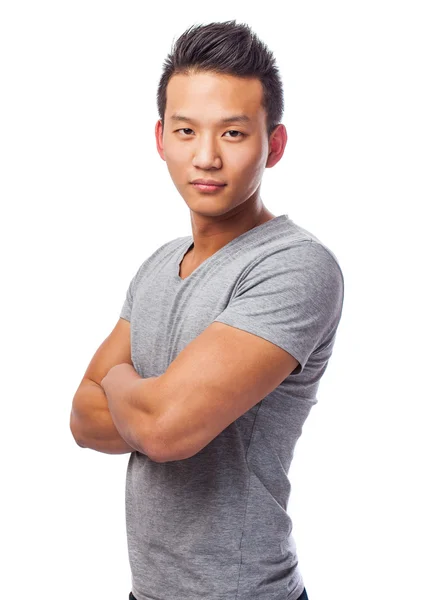 Yakışıklı Asya genç adam ayakta — Stok fotoğraf