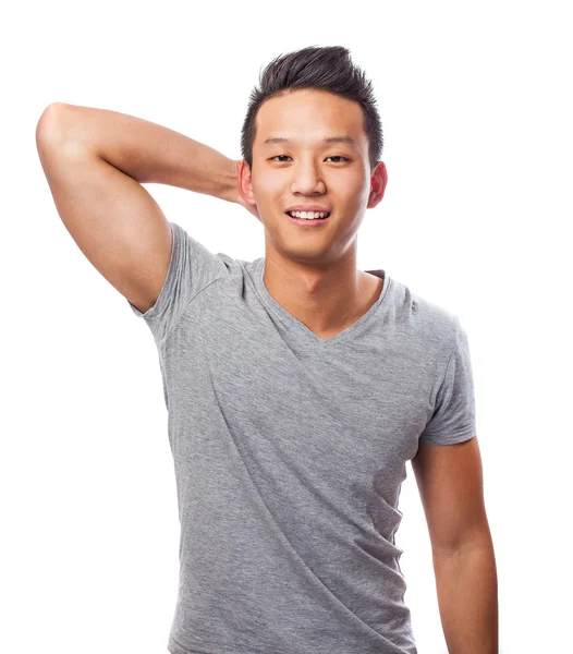 Schöner asiatischer junger Mann steht — Stockfoto