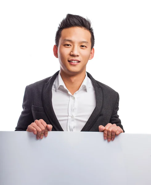 Young asian man holding banner — Stock Photo, Image