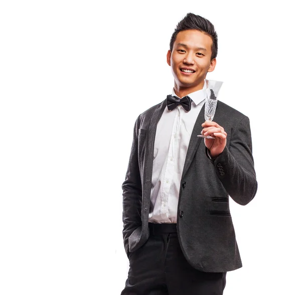 Asian man holding glass — Stock Photo, Image