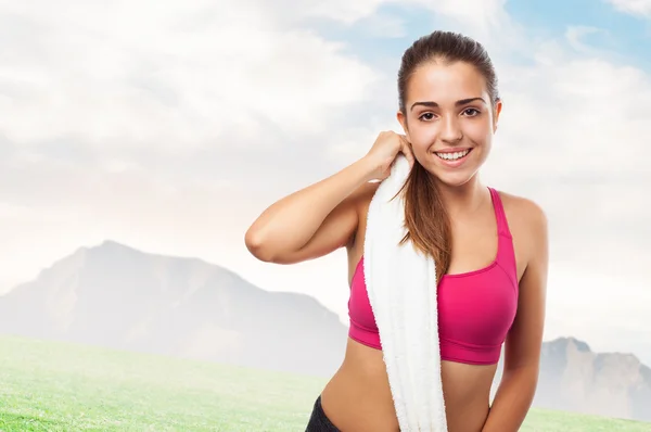 Sporty young girl holding towel — Stock Photo, Image