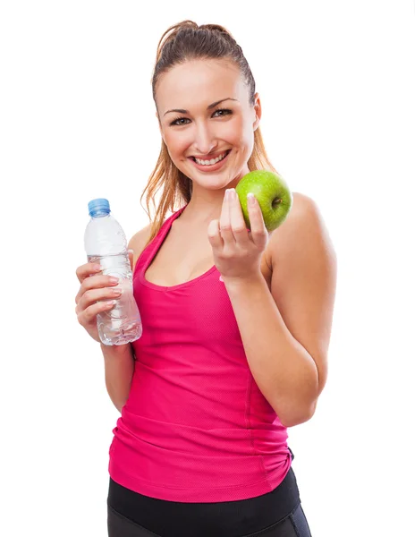 Young woman showing apple — Stock Photo, Image