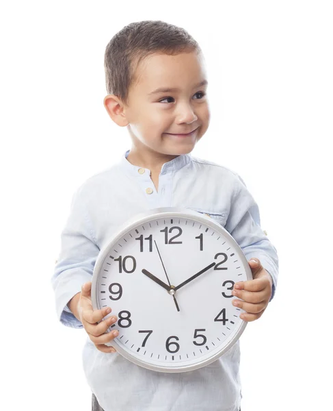 Little boy holding clock — Stock Photo, Image