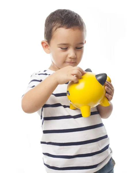 Pequeño niño sosteniendo alcancía —  Fotos de Stock