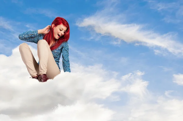 Young woman looking from cloud — Stock Photo, Image