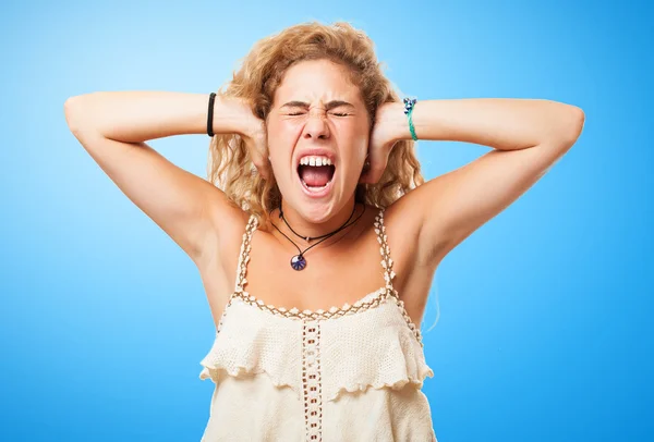 Stressed young girl covering ears — Stock Photo, Image