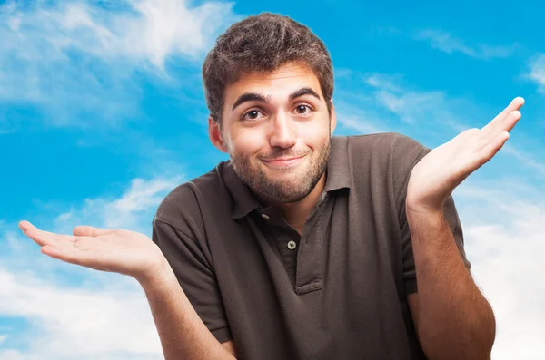 Handsome young man having doubt — Stock Photo, Image