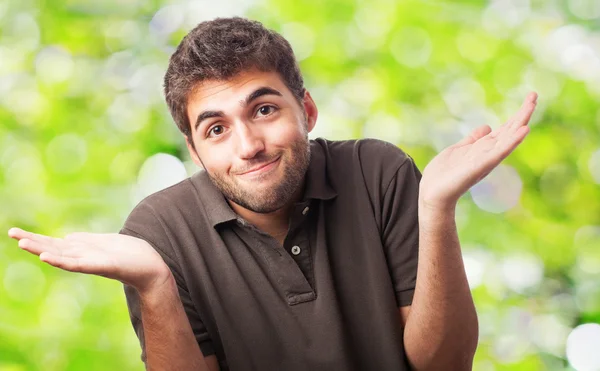 Handsome young man having doubt — Stock Photo, Image