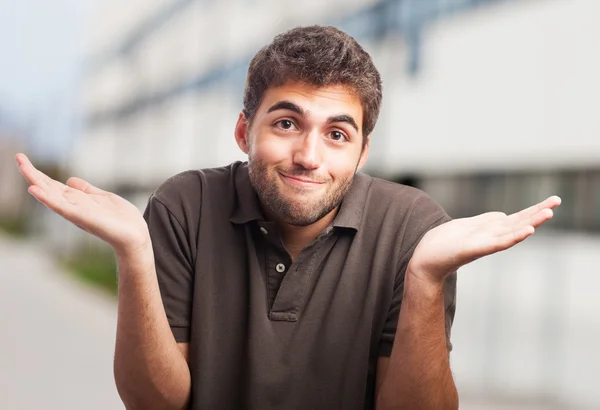 Handsome young man having doubt — Stock Photo, Image