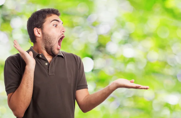 Surprised man holding something — Stock Photo, Image