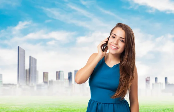 Pretty young girl talking on telephone — Stock Photo, Image