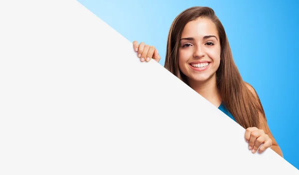 Pretty girl showing empty banner — Stock Photo, Image