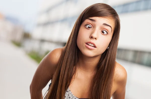 Young pretty girl kidding and squinting — Stock Photo, Image