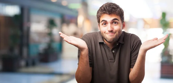 Handsome young man having doubt — Stock Photo, Image