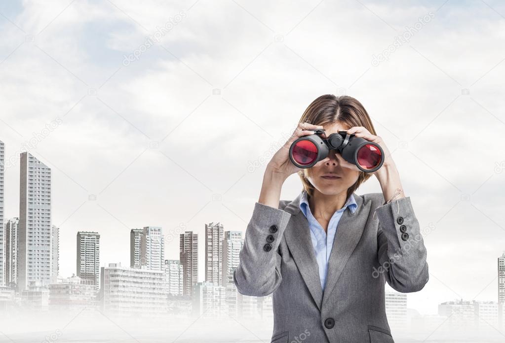 Young woman with binoculars