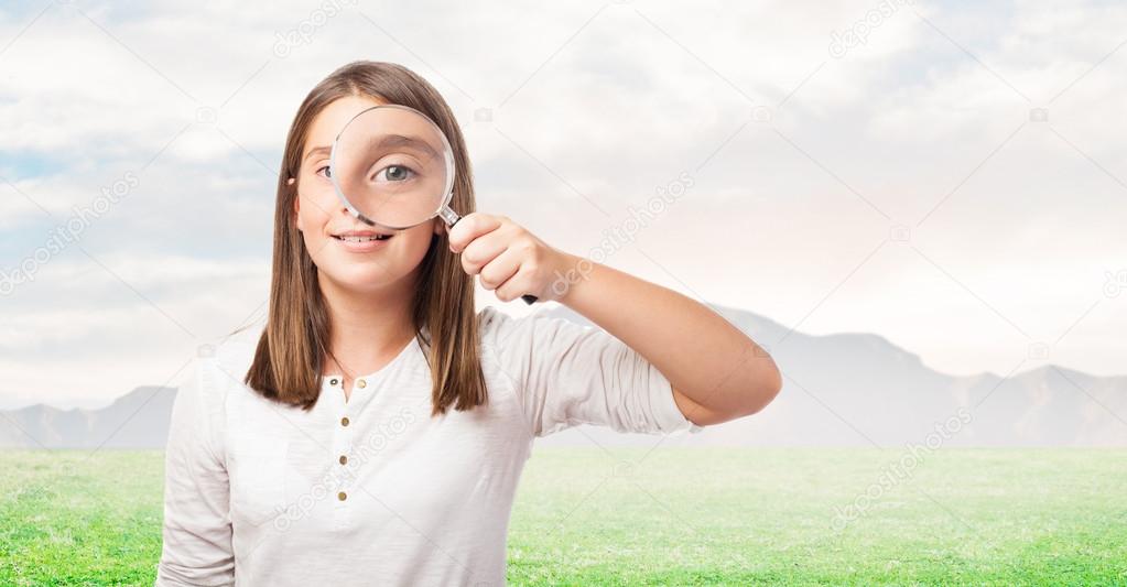 Young girl with magnifying glass