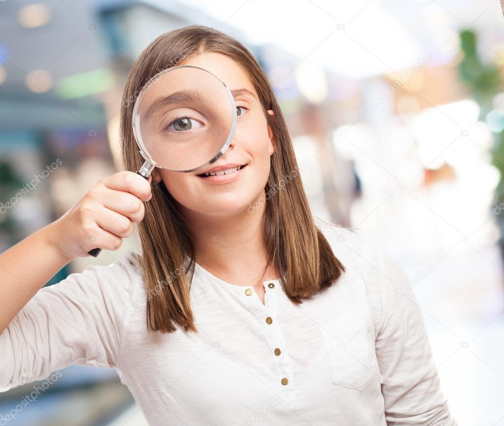 Young girl with magnifying glass