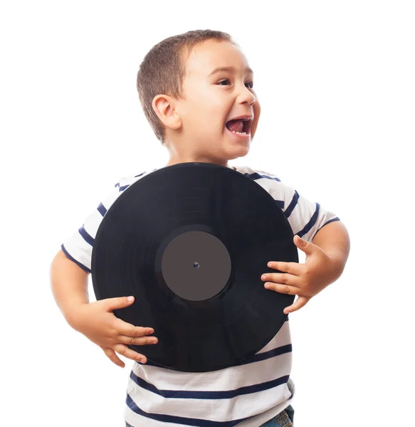 Pequeño niño sosteniendo disco de vinilo — Foto de Stock