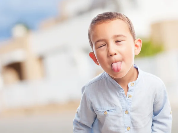 Little boy sticking out tongue — Stock Photo, Image