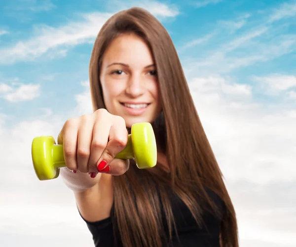 Pretty young girl holding weights — Stock Photo, Image