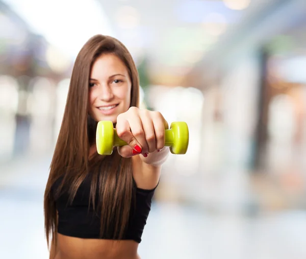 Pretty young girl holding weights — Stock Photo, Image