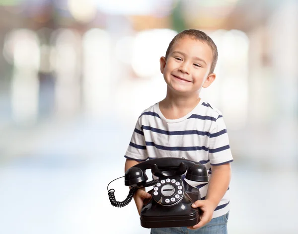 Little boy holding telephone — Stock Photo, Image