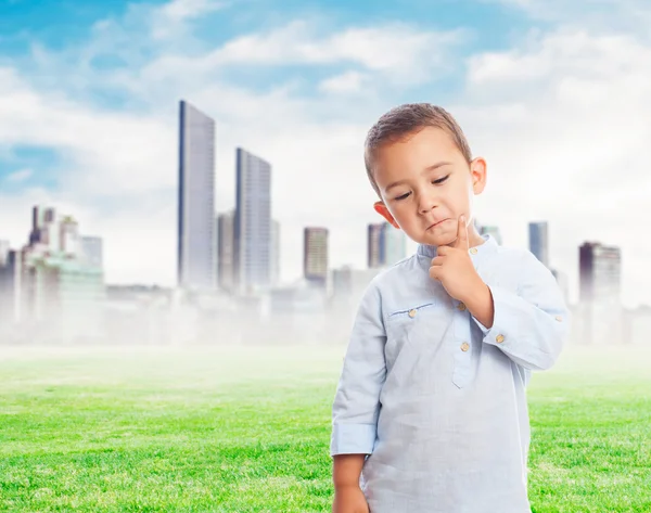 Little boy thinking and serious — Stock Photo, Image