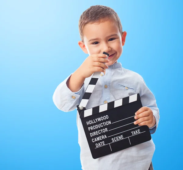 Little boy holding clapper board — Stock Photo, Image