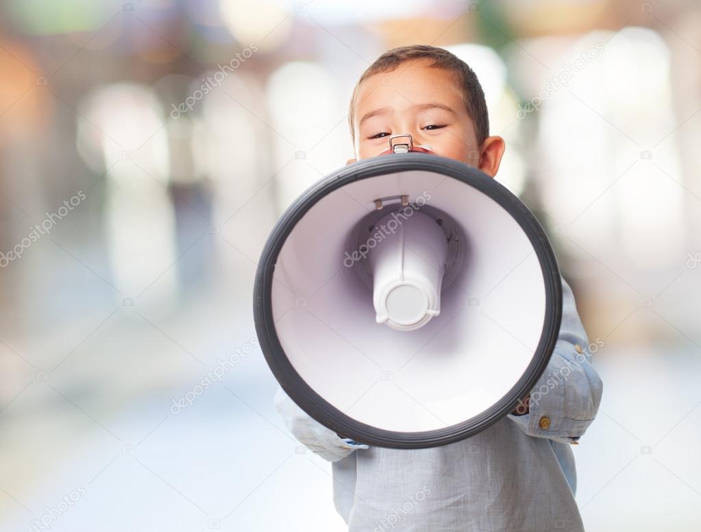 Little boy covering with megaphone