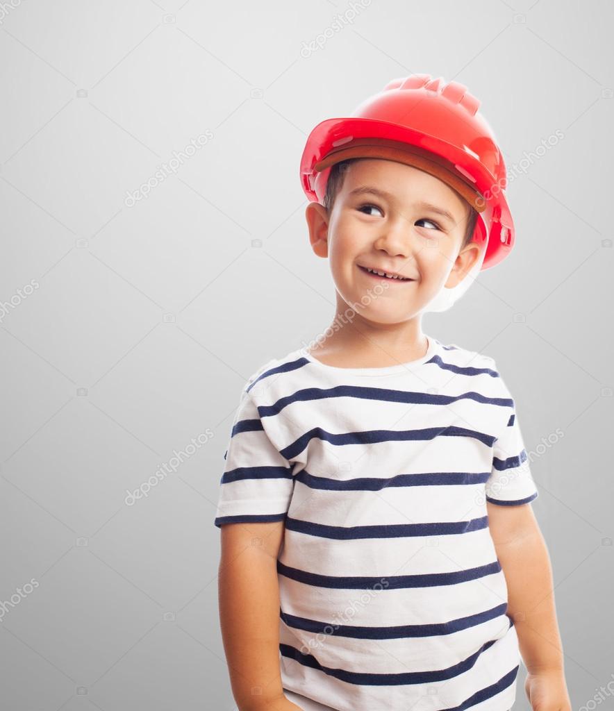 Little boy wearing mason helmet