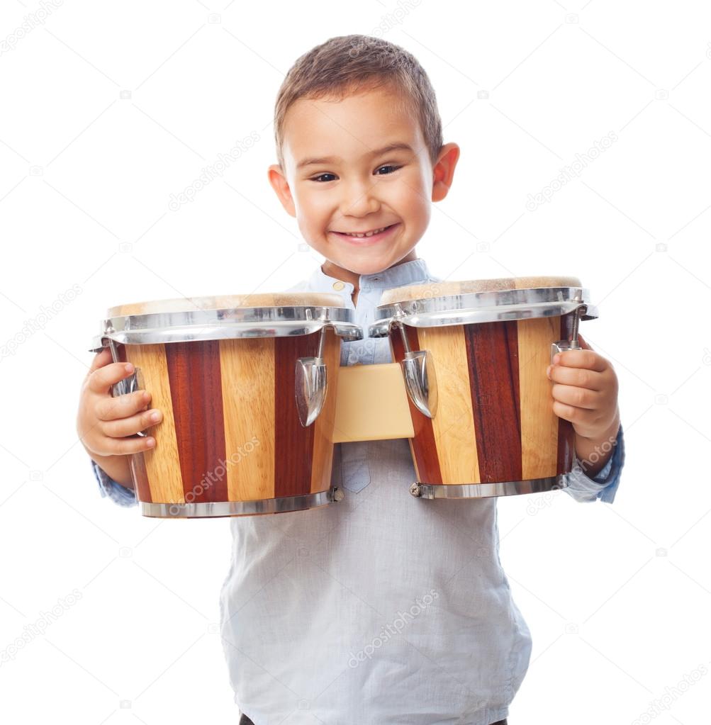 Little boy holding drum