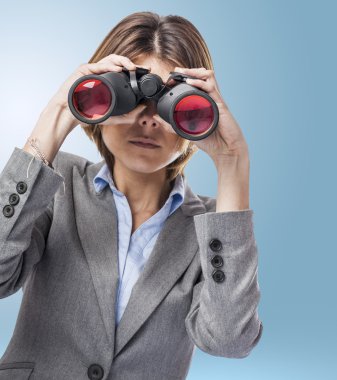 Young woman looking through binoculars clipart