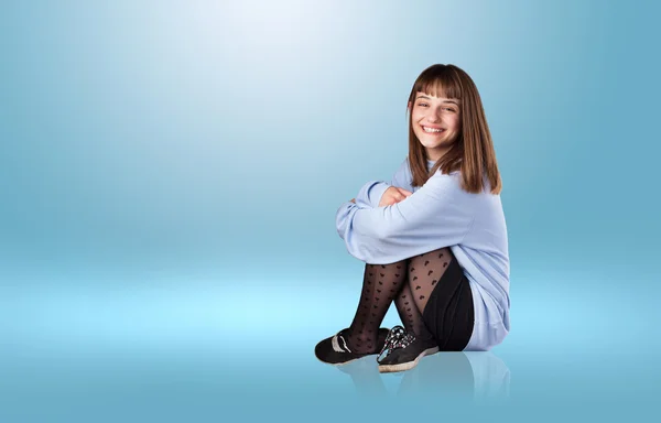 Young woman sitting — Stock Photo, Image