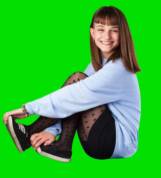 Young woman sitting — Stock Photo, Image