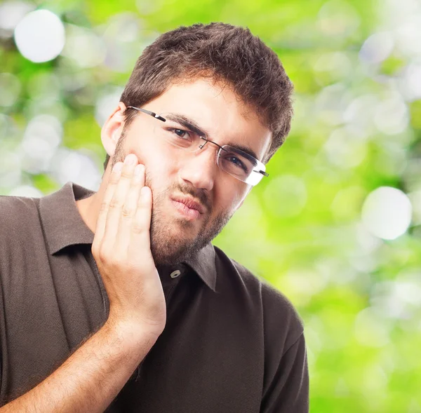 Young man suffering strong toothache — Stock Photo, Image