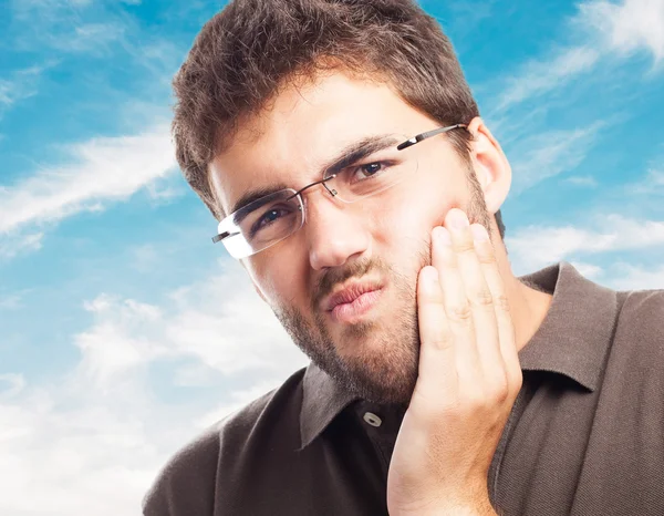 Young man suffering strong toothache — Stock Photo, Image