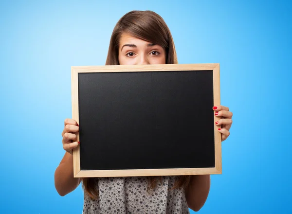 Student verborgen achter schoolbord — Stockfoto