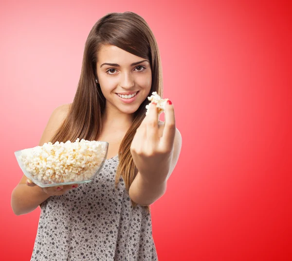 Young girl eating pop corn — Stock Photo, Image