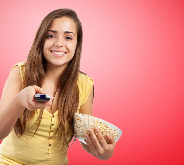 Young girl eating pop corn — Stock Photo, Image