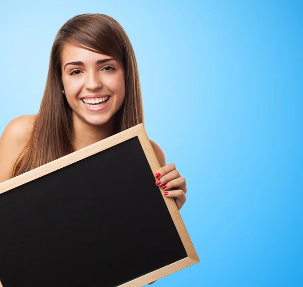 Pretty student holding chalkboard — Stock Photo, Image