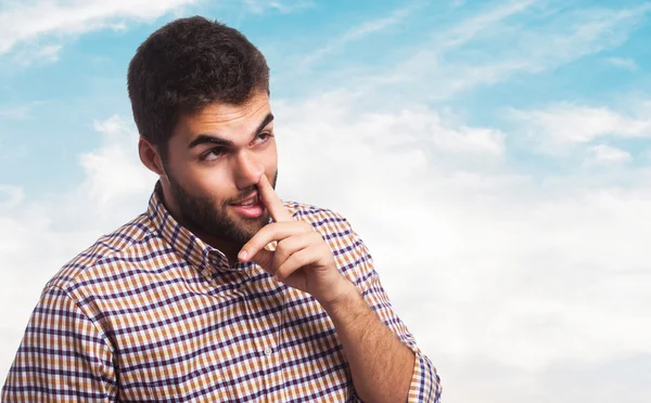 Young man with finger into nose — Stock Photo, Image