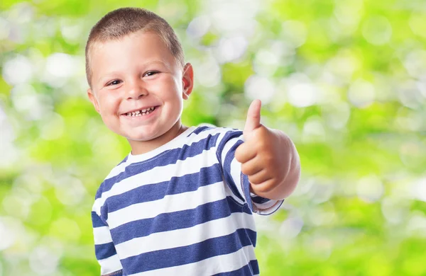 Cute kid doing positive sign — Stock Photo, Image