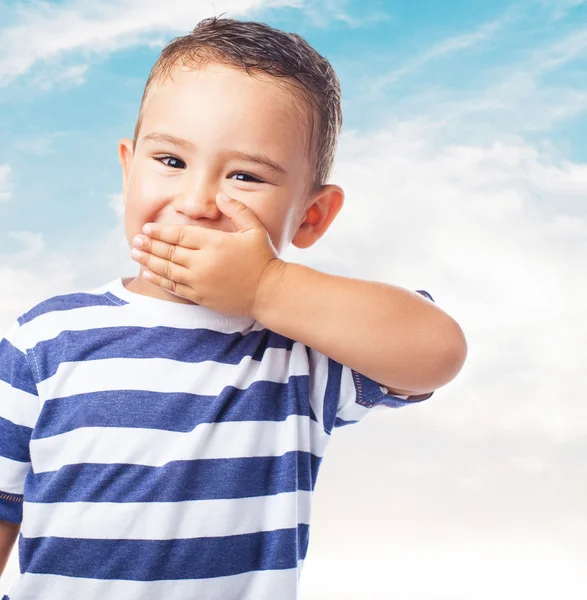 Cute kid covering his mouth — Stock Photo, Image